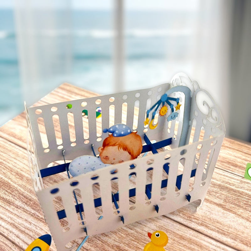 Color Pop Cards baby boy crib pop-up greeting card with sleeping baby and mobile