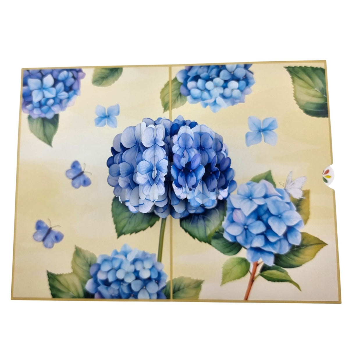Color Pop Cards blue hydrangea pop-up greeting card with butterflies and green leaves on a pale yellow background.