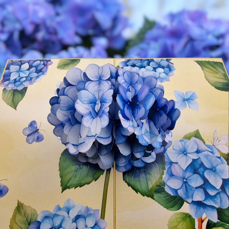 Color Pop Cards blue hydrangea pop-up greeting card with butterflies and envelope. Perfect for anniversaries or Mother's Day.
