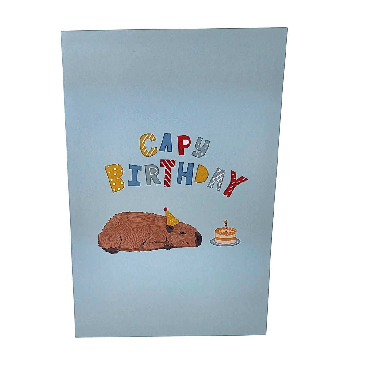 Color Pop Cards light blue pop-up birthday card featuring a capybara wearing a party hat and a birthday cake.