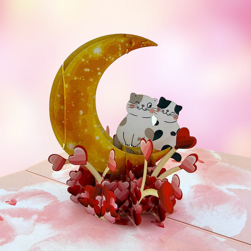 Color Pop Cards Meow Forever pop-up card featuring two cats sitting on a crescent moon surrounded by hearts.