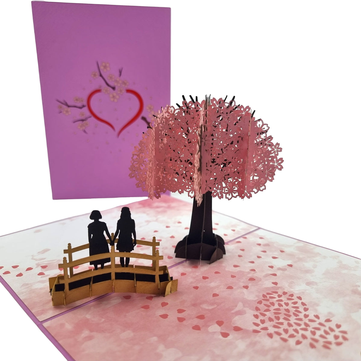 Color Pop Cards Cherry Blossom Love Scene Same Sex Female Pop-Up Card with pink tree and couple on bridge.