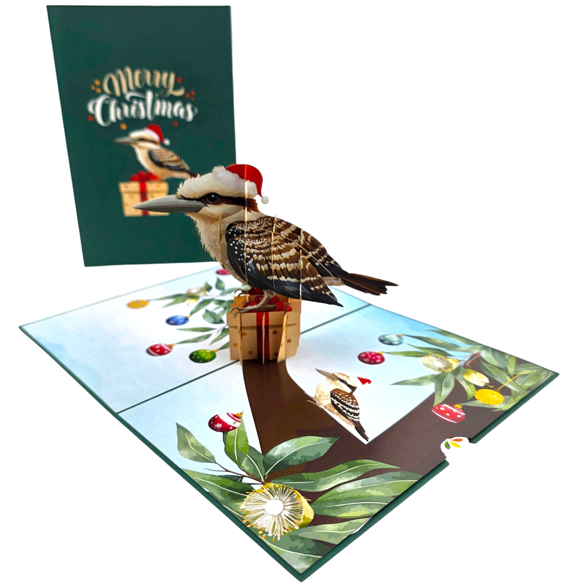 Color Pop Cards Christmas Kookaburra pop-up card featuring a bird in a Santa hat sitting on a gift inside a tree