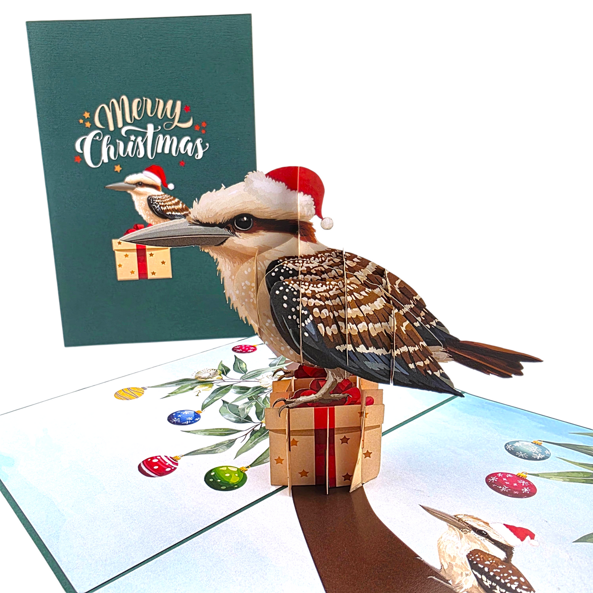 Color Pop Cards Christmas Kookaburra pop-up card featuring a bird in a Santa hat sitting on a gift under ornaments