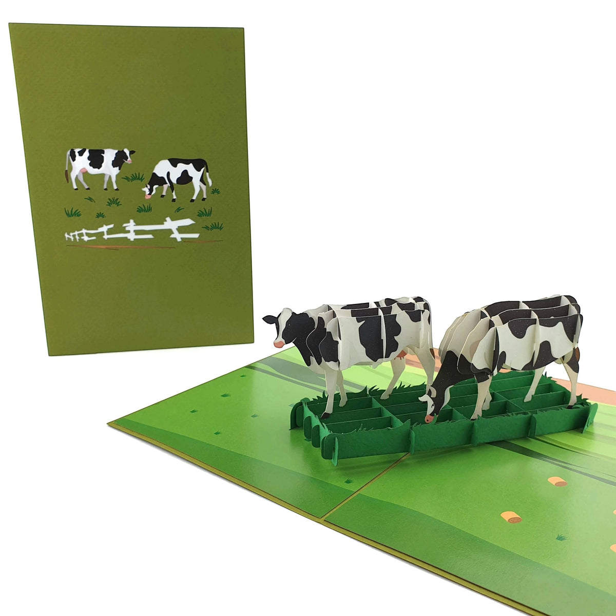 Color Pop Cards green pop-up card with 3D black and white cows grazing in a field. Includes envelope.