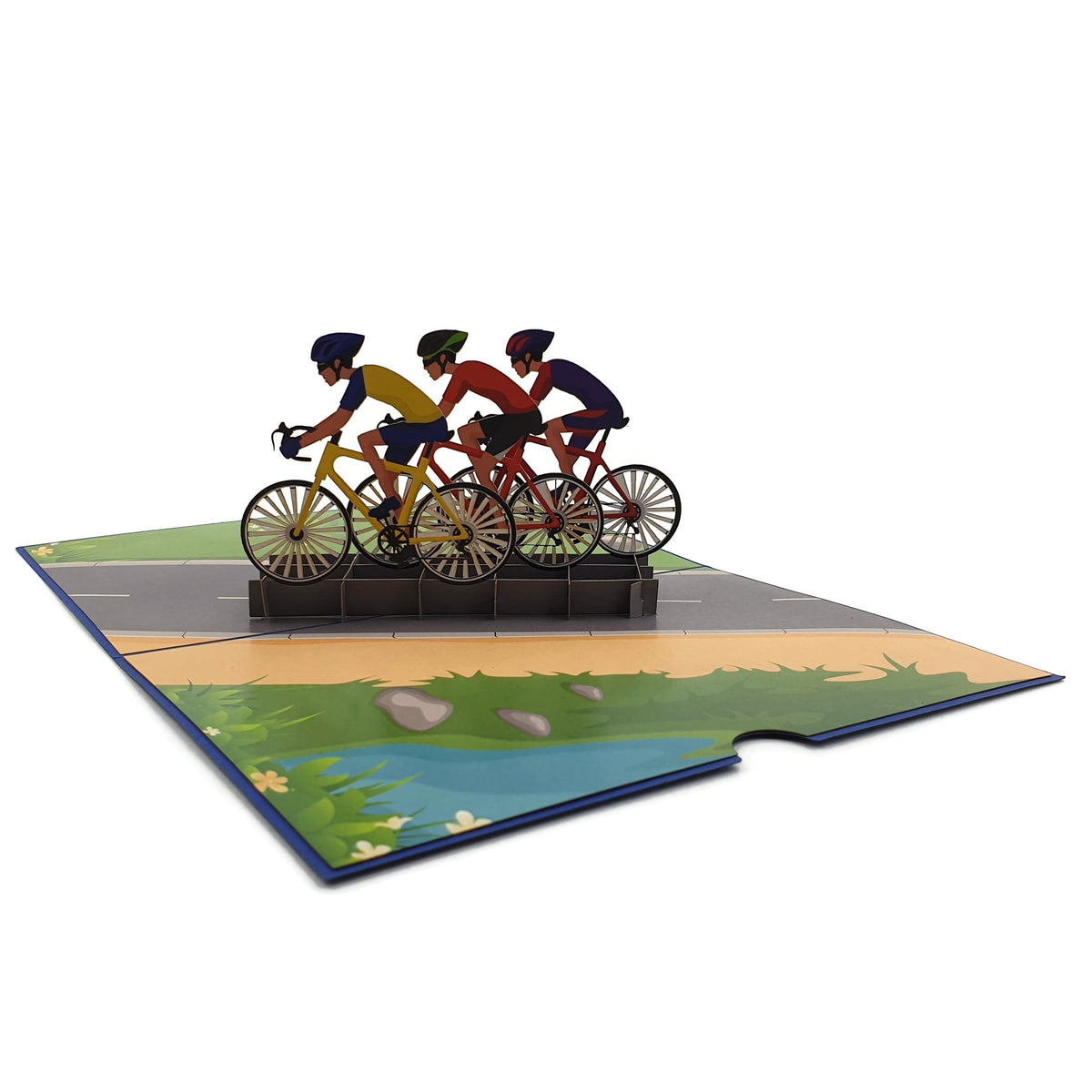 Color Pop Cards cycling race pop-up card with three cyclists on a road. Features a vibrant landscape with a river and grass.