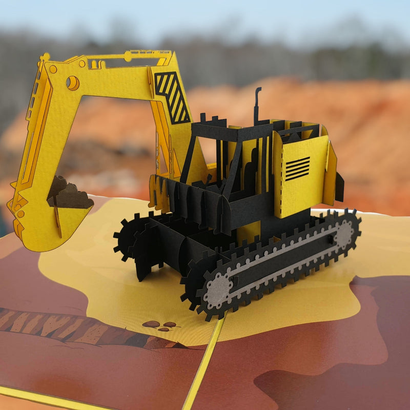Color Pop Cards yellow and black 3D construction excavator pop-up card with movable bucket and detailed tracks.