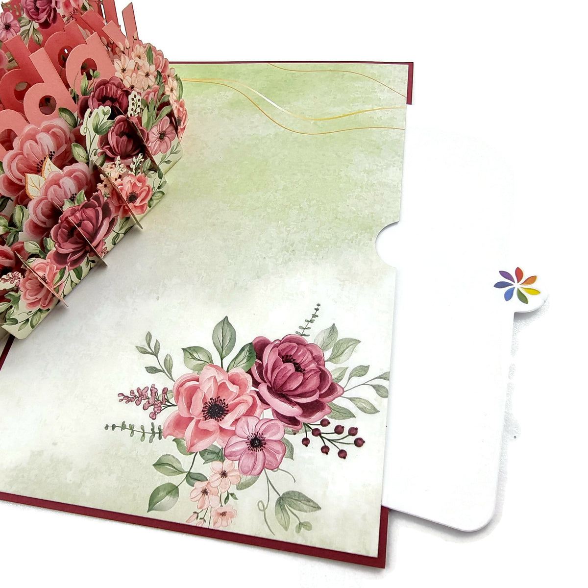 Color Pop Cards floral birthday pop up card with 3D bouquet and "Happy Birthday" message. Red exterior with floral accents.