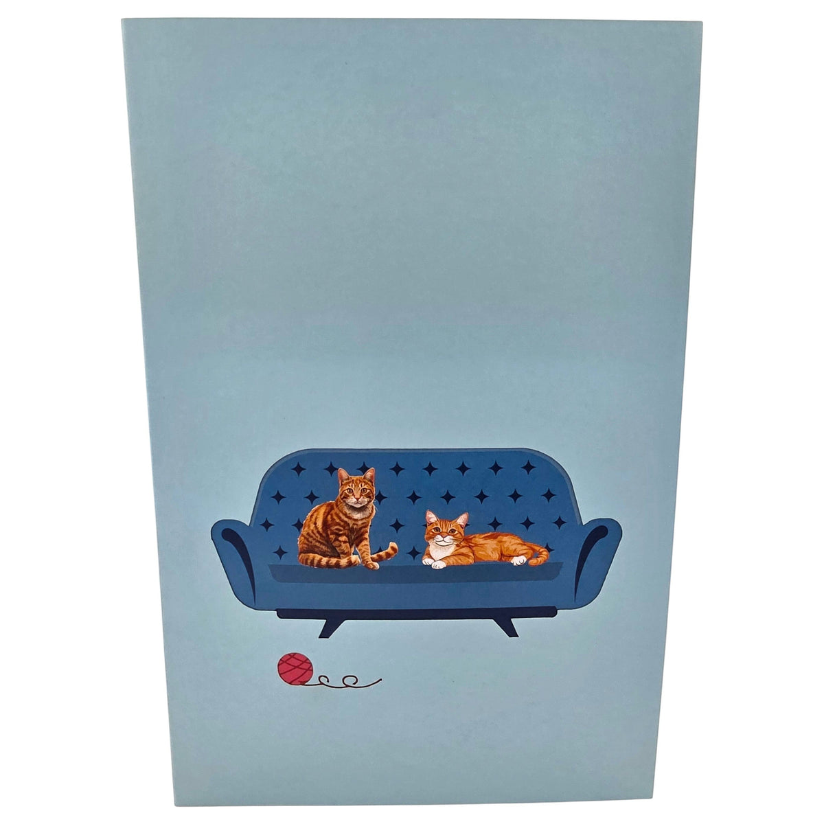 Color Pop Cards blue pop-up card featuring two ginger cats on a blue sofa with a ball of yarn.