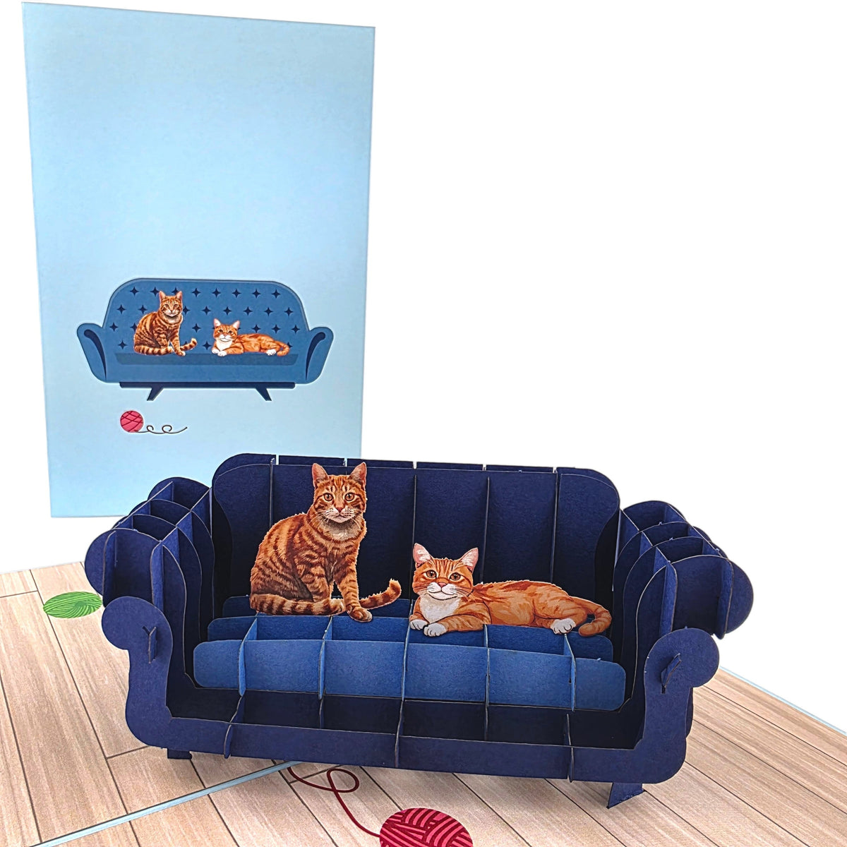 Color Pop Cards blue pop-up card featuring two ginger cats on a navy sofa, with a 3D sofa inside.