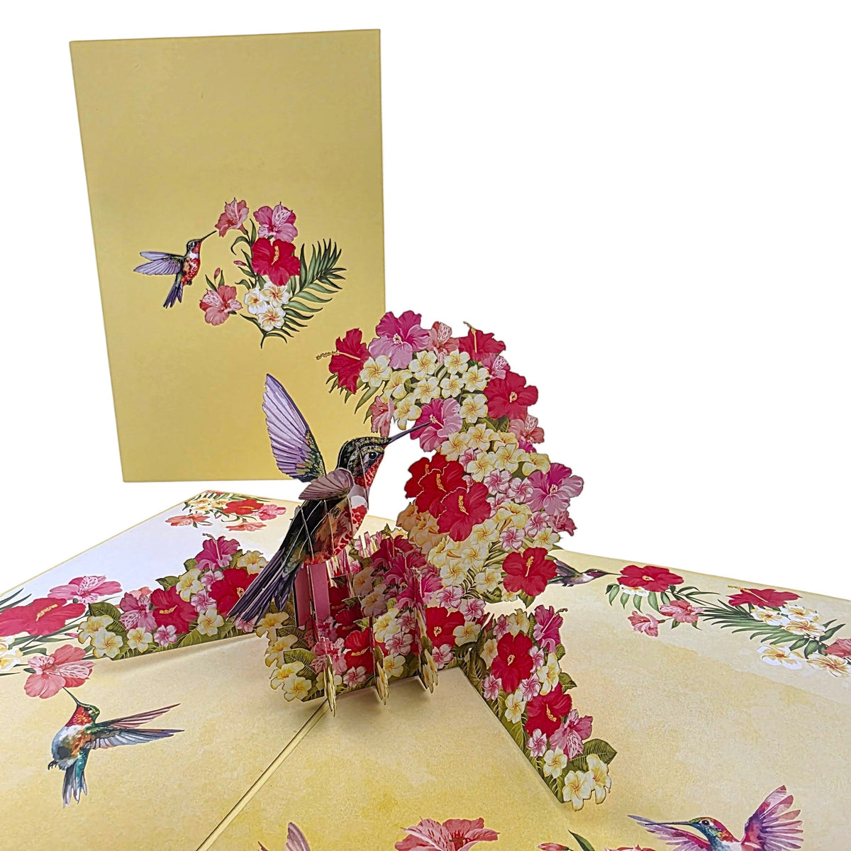 Color Pop Cards hummingbird and floral pop-up greeting card with intricate papercraft, 3D design, yellow background, hibiscus and plumeria flowers.