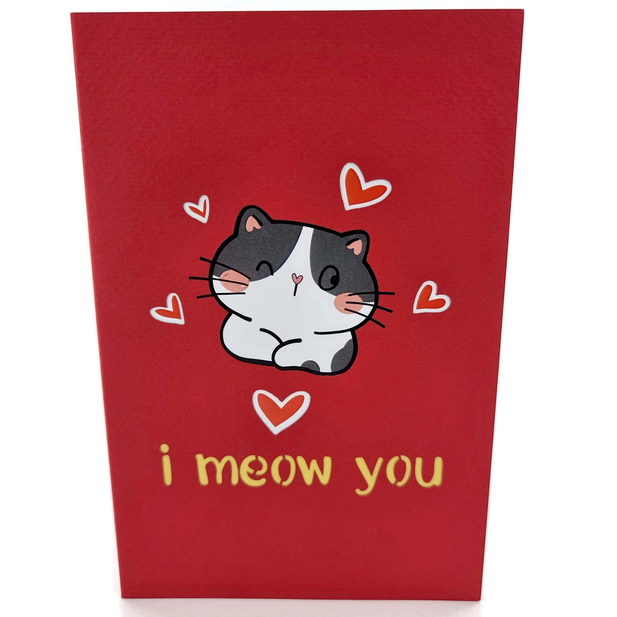 Color Pop Cards red pop-up card featuring a cute black and white cat surrounded by hearts and the text "i meow you".