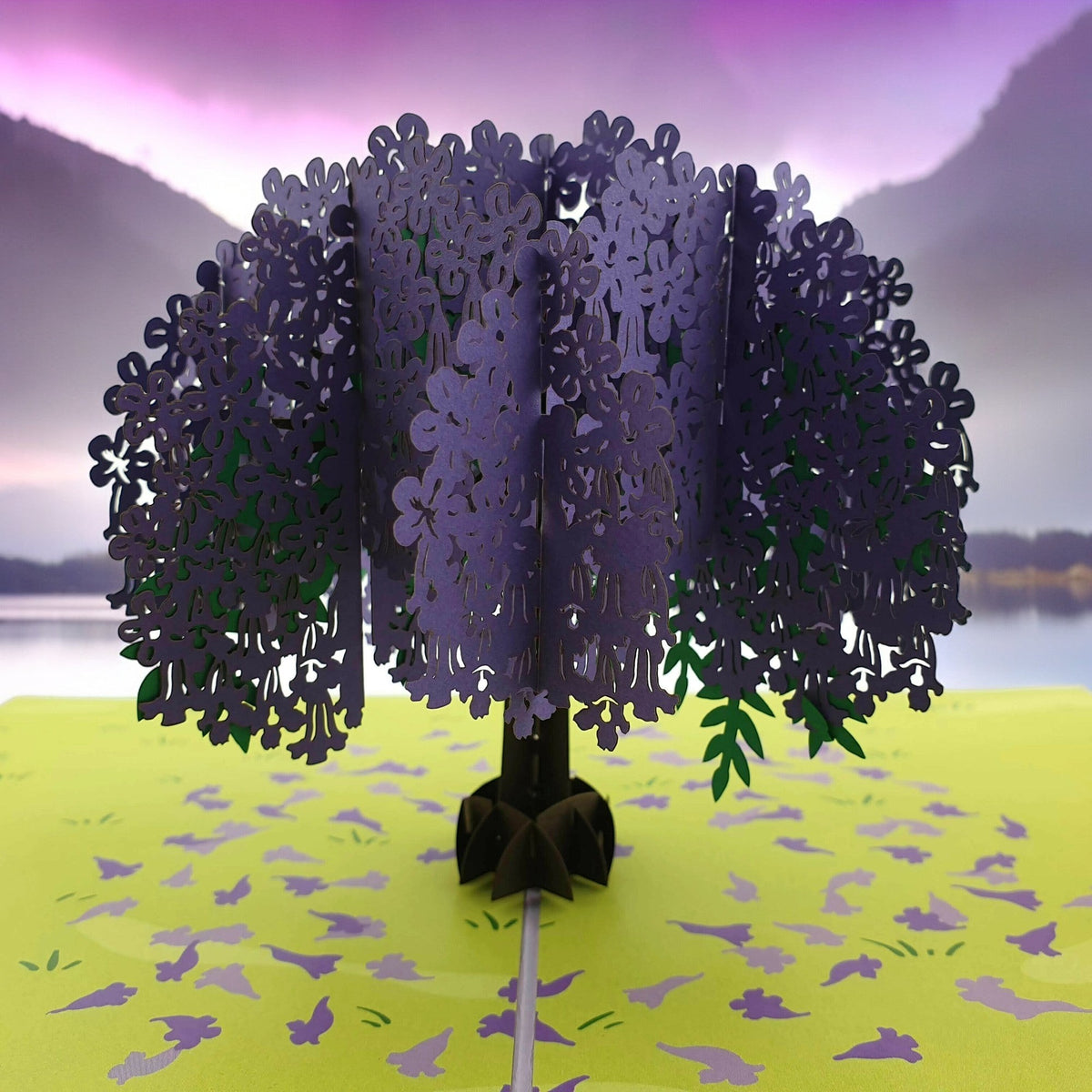 Color Pop Cards Jacaranda Tree pop-up card with purple flowers and green leaves on a light green field.