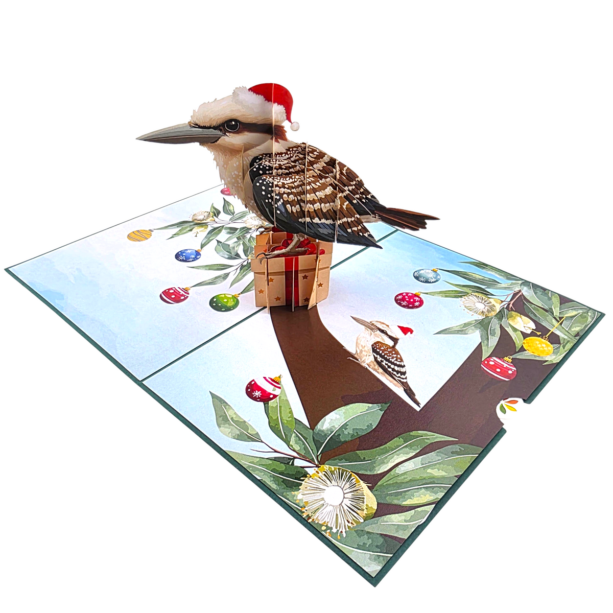 Color Pop Cards Christmas Kookaburra pop-up card featuring a bird in a Santa hat sitting on a gift in a tree