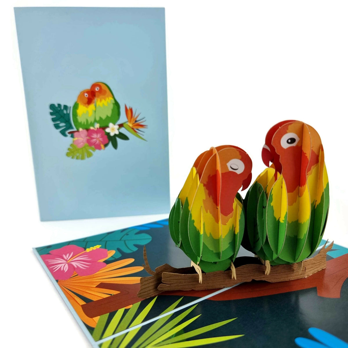 Color Pop Cards Love Birds pop-up card featuring two colorful lovebirds on a branch with tropical flowers.