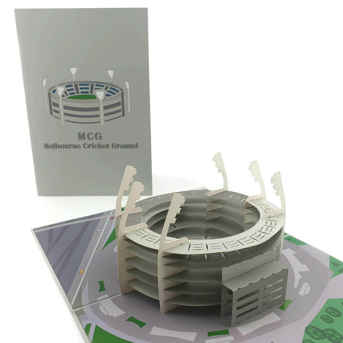 Color Pop Cards MCG Melbourne Cricket Ground pop up card, a 3D paper model of the stadium with light towers.