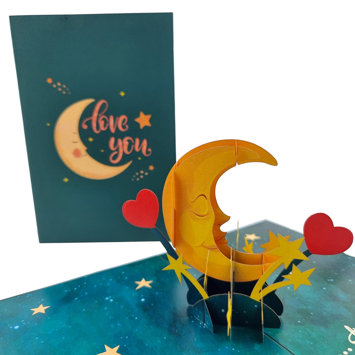 Color Pop Cards Love You To The Moon and Back pop-up card with a smiling crescent moon and red hearts.