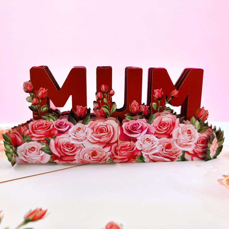 Color Pop Cards red 3D pop up card with "MUM" in large letters surrounded by pink and red roses.