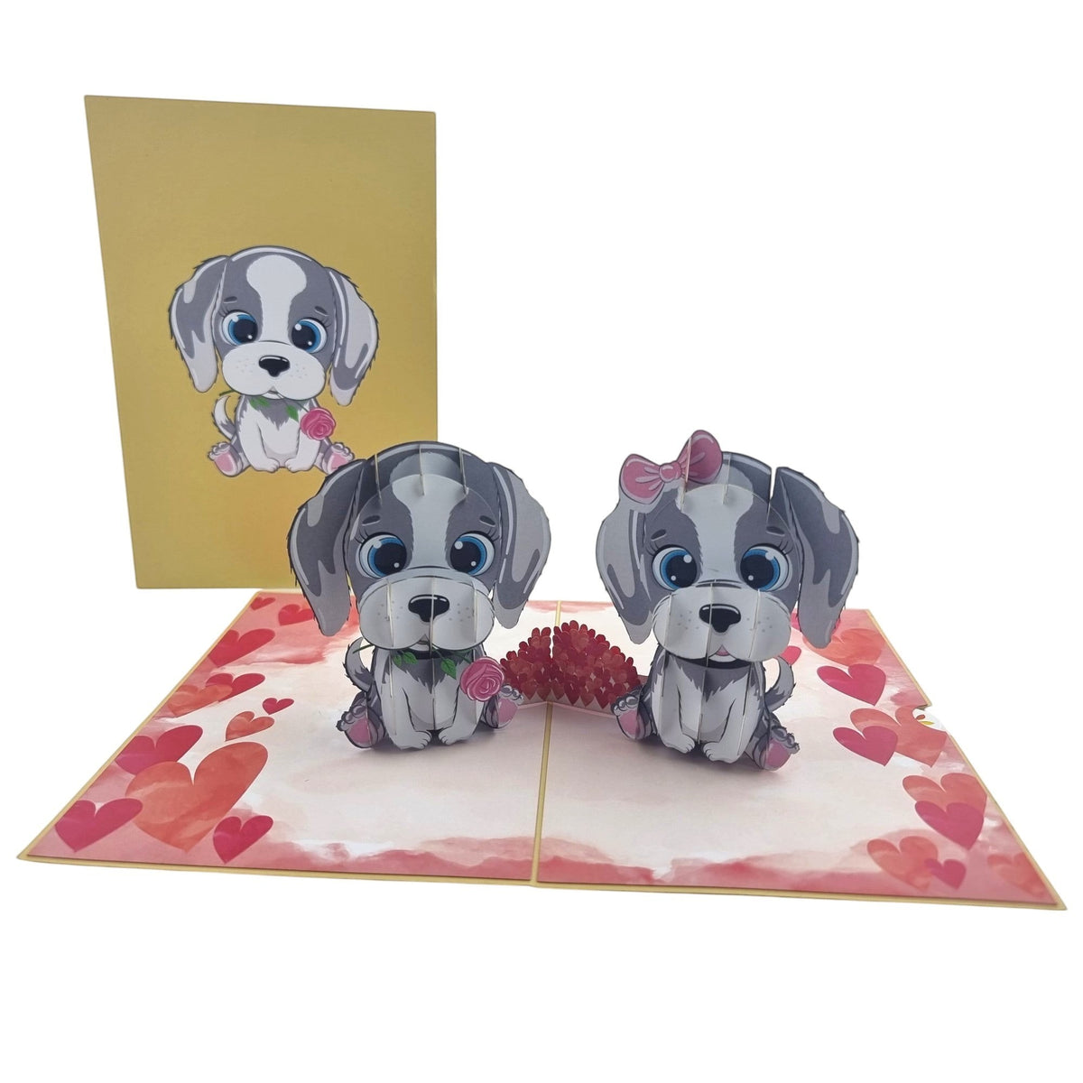 Color Pop Cards Puppy Love pop-up card featuring two grey and white cartoon puppies, one with a pink bow, holding roses. Includes envelope.