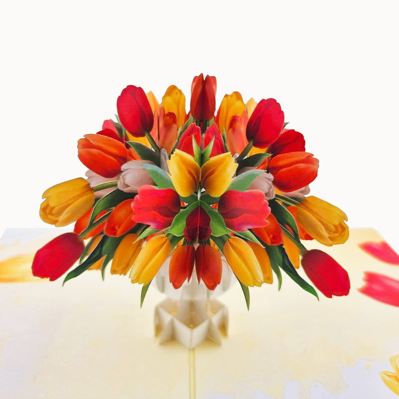 Color Pop Cards tulip bouquet pop-up card with red, orange, and yellow tulips in a white vase.