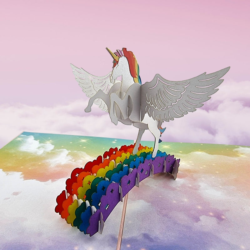 Color Pop Cards Unicorn Rainbow Pop Up Card for kids, 3D winged unicorn on rainbow, intricate papercraft, ideal for birthdays.