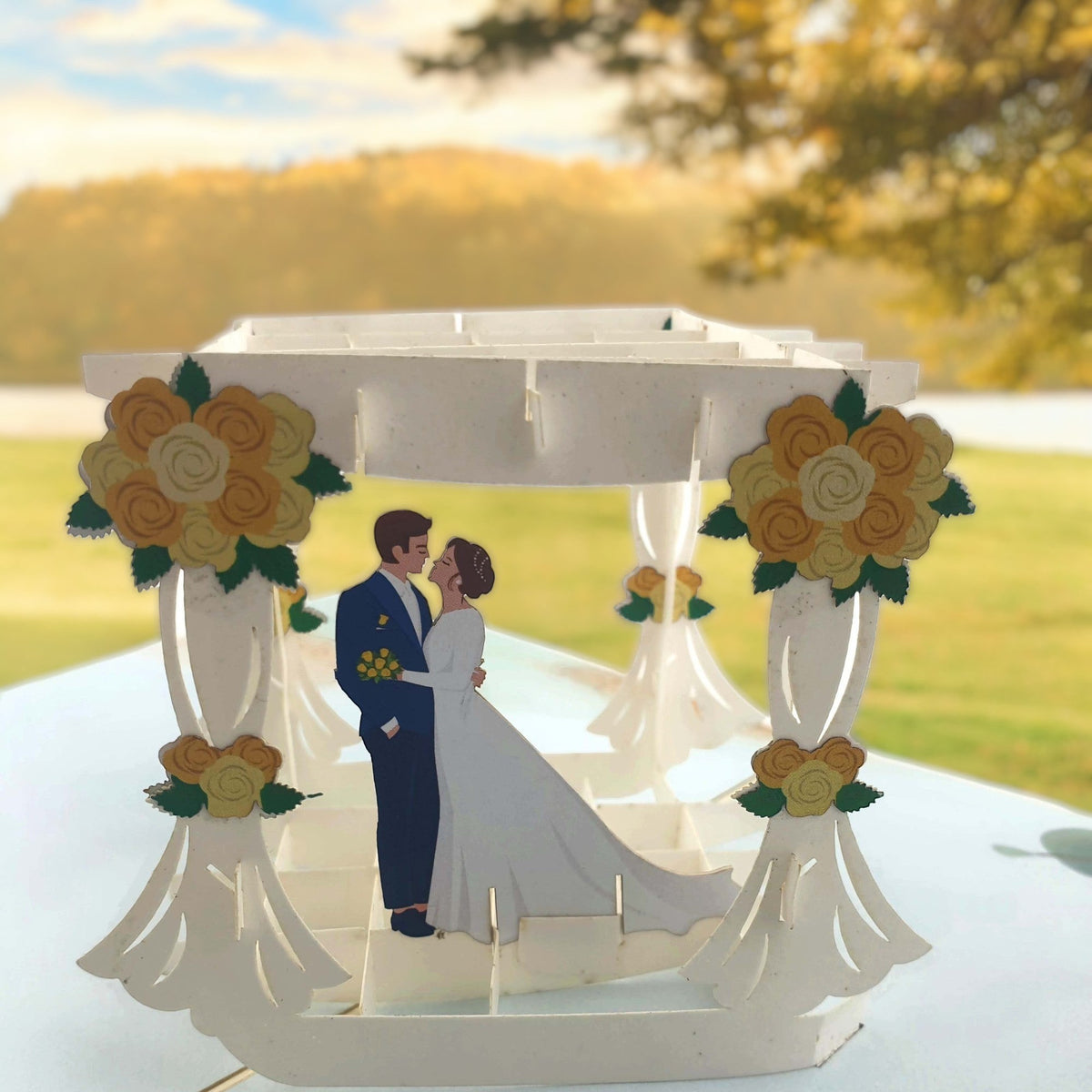 Color Pop Cards Wedding Arbour pop-up card featuring a bride and groom under a white arbour with yellow flowers.