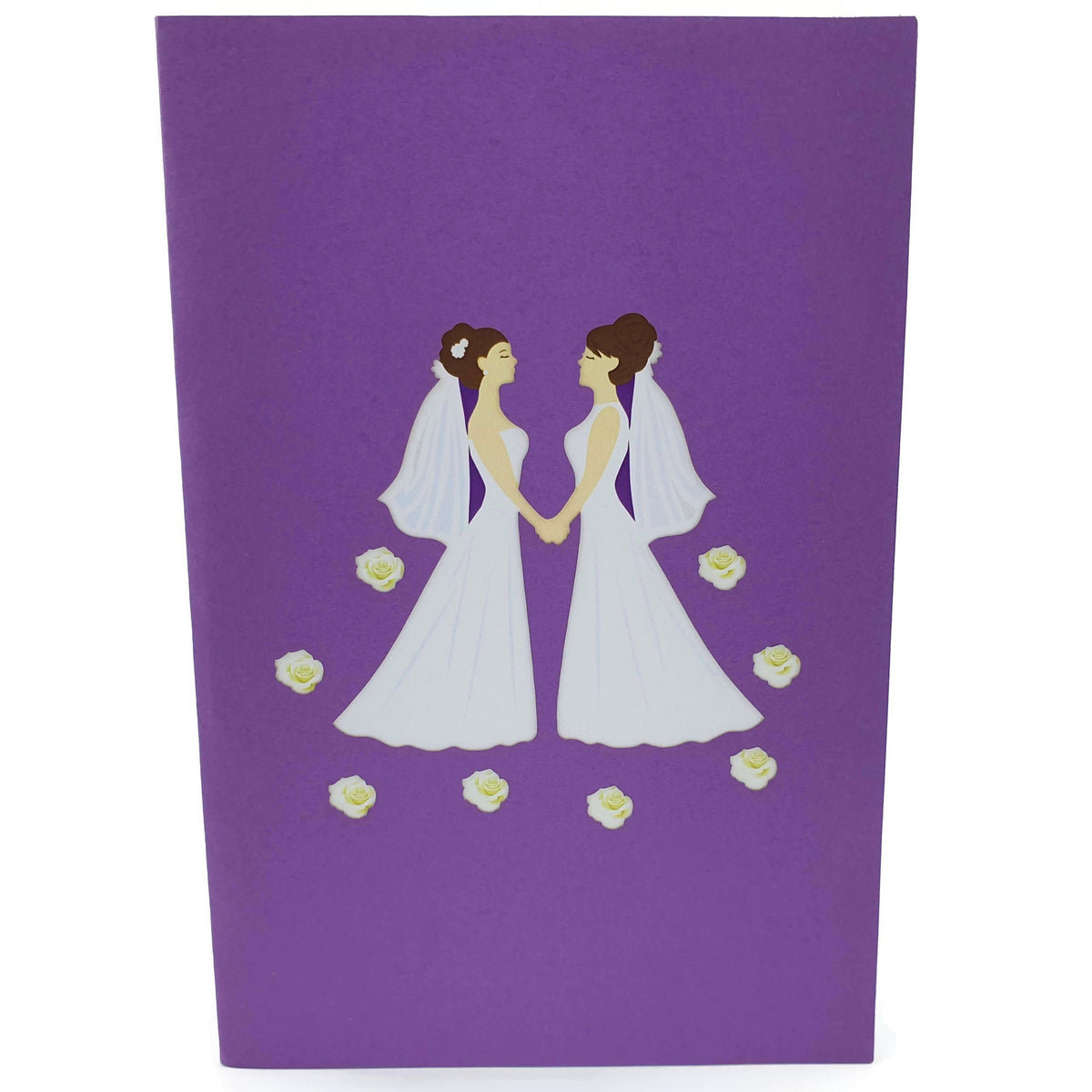 Color Pop Cards wedding pop-up card featuring two brides in white dresses holding hands, surrounded by white roses on a purple background.