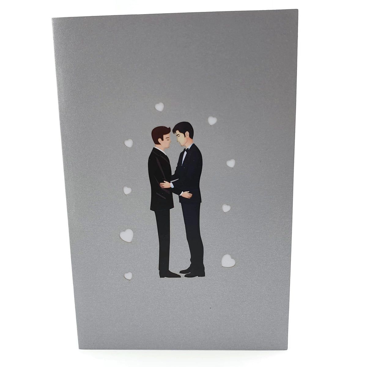 Color Pop Cards Wedding Day Grooms Pop-Up Card featuring two men in tuxedos embracing, with small hearts on a silver cover.