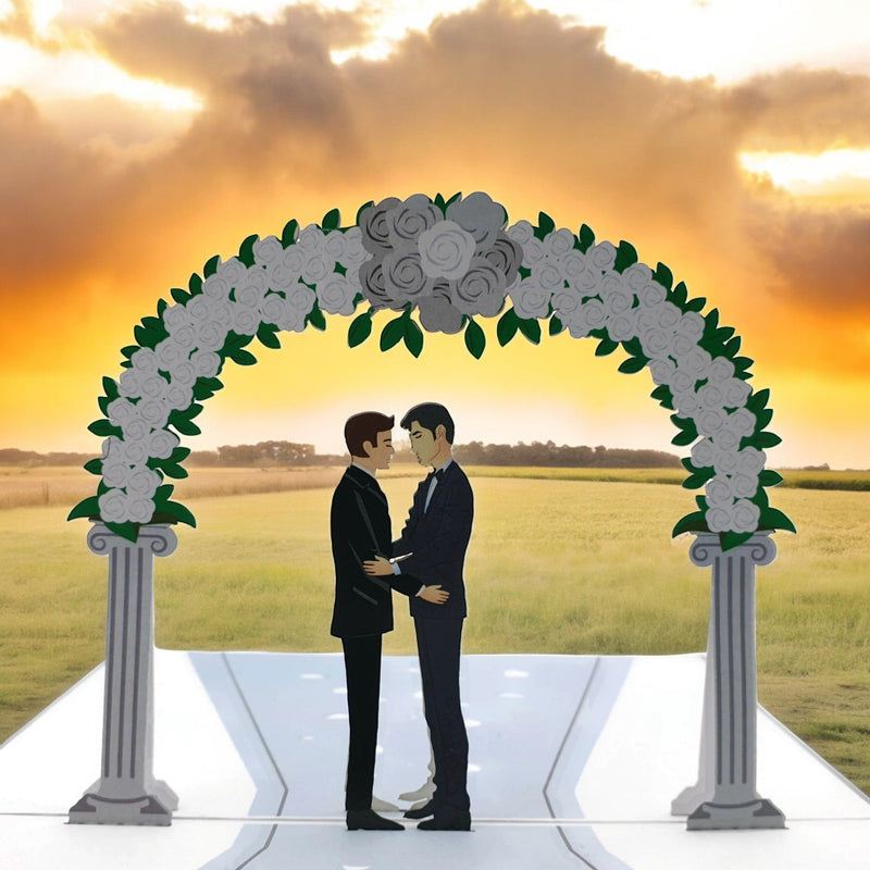 Color Pop Cards Wedding Day Grooms Pop-Up Card featuring two grooms in tuxedos under a floral arch. Includes white envelope.