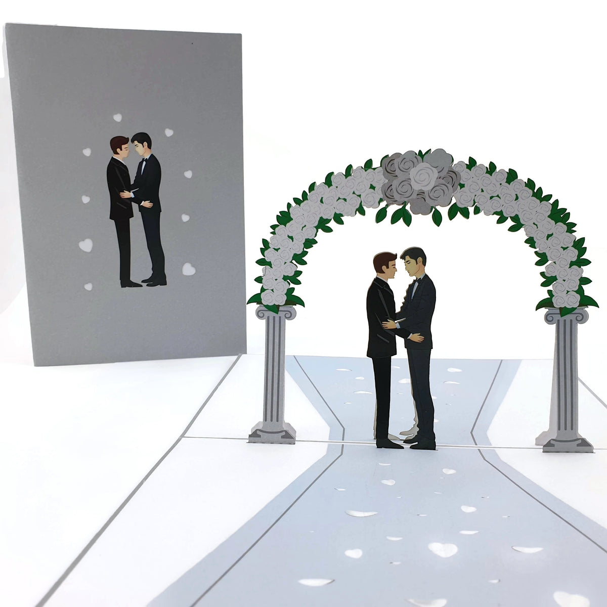 Color Pop Cards wedding day pop-up card featuring two grooms in tuxedos under a floral arch. Includes envelope.