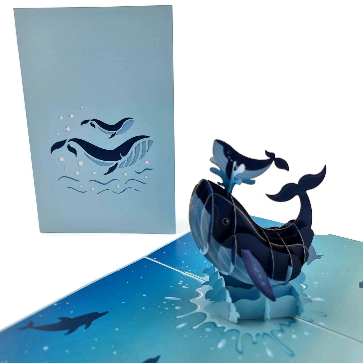 Color Pop Cards Blue Whale Family pop up card with mother and baby whale leaping from water.
